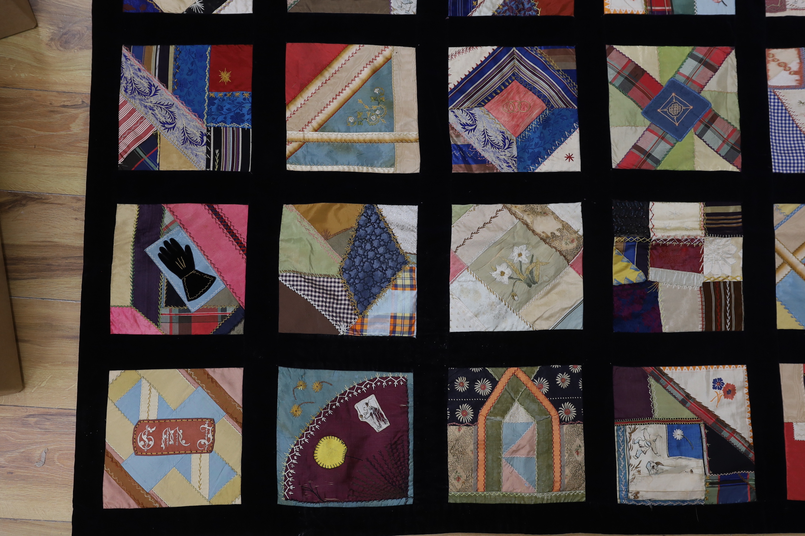 A 19th century crazy patchwork quilt worked with silks and velvets in novelty motifs